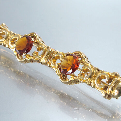 ORNAMENTBROSCHE mit 2 Madeira-Topas  - 14K/ Gelbgold - 7,3 g